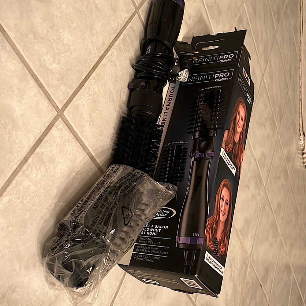 EUC purple hot air spin brush. Comes with box,  directions and all accessories